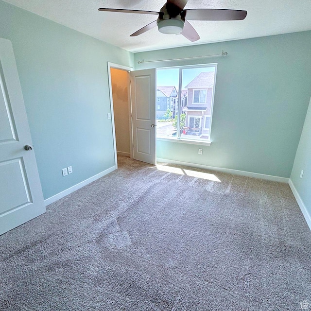 5382 W Tioga Pl, Herriman, UT 84096 - unfurnished bedroom featuring carpet, ceiling fan, and a textured ceiling