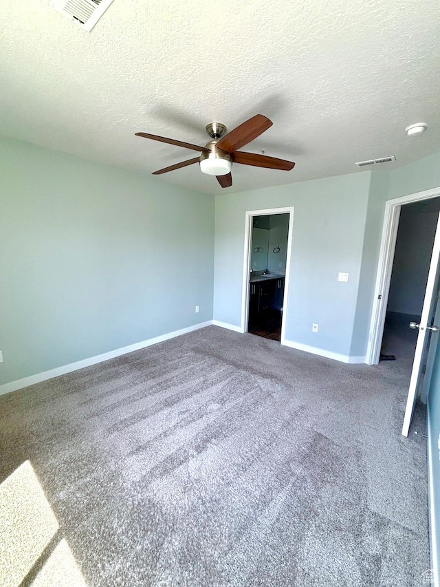 5382 W Tioga Pl, Herriman, UT 84096 - unfurnished bedroom with carpet floors, a textured ceiling, ceiling fan, and ensuite bath