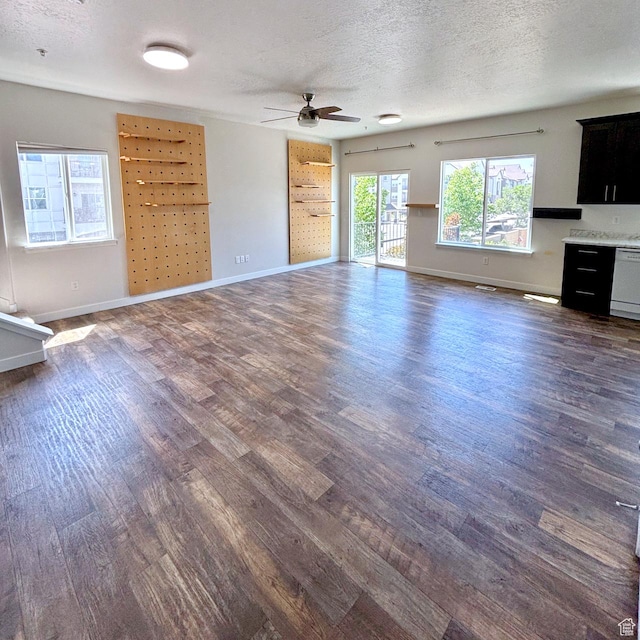 5382 W Tioga Pl, Herriman, UT 84096 - unfurnished living room featuring dark wood finished floors, ceiling fan, and a textured ceiling
