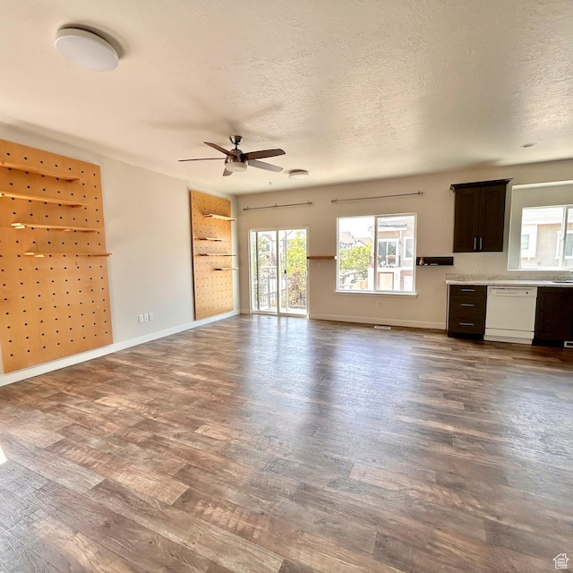 5382 W Tioga Pl, Herriman, UT 84096 - unfurnished living room featuring dark wood finished floors, ceiling fan, and a textured ceiling