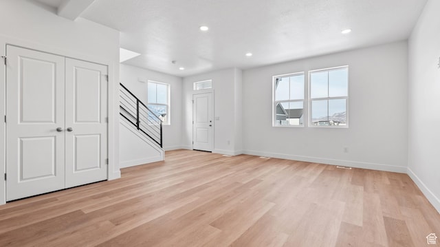 1068 E 1930 S Unit 421, Heber City, UT 84032 - foyer with stairs, light wood finished floors, healthy amount of natural light, and recessed lighting