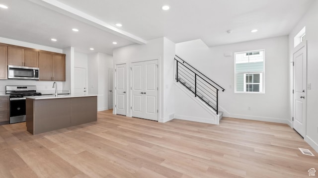 1068 E 1930 S Unit 421, Heber City, UT 84032 - kitchen with stainless steel appliances, light wood finished floors, recessed lighting, light countertops, and a kitchen island with sink