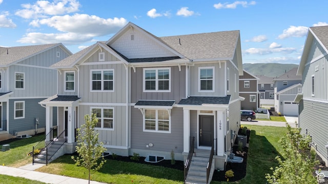 1068 E 1930 S Unit 421, Heber City, UT 84032 - view of front facade with board and batten siding and roof with shingles