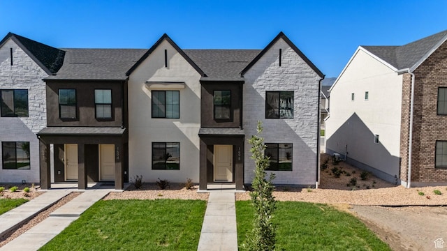 1557 E 720 N Unit 1070, Salem, UT 84653 - view of front of home with stone siding, a shingled roof, and a front yard