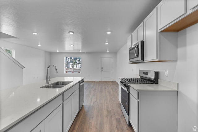 1557 E 720 N Unit 1070, Salem, UT 84653 - kitchen with appliances with stainless steel finishes, light wood-style floors, recessed lighting, and white cabinets