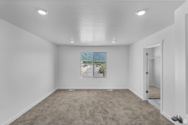 1557 E 720 N Unit 1070, Salem, UT 84653 - unfurnished bedroom featuring carpet, recessed lighting, and a walk in closet