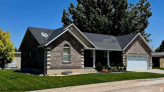 65 E 300 S, Salina, UT 84654 - view of front facade with an attached garage, driveway, a front yard, and brick siding