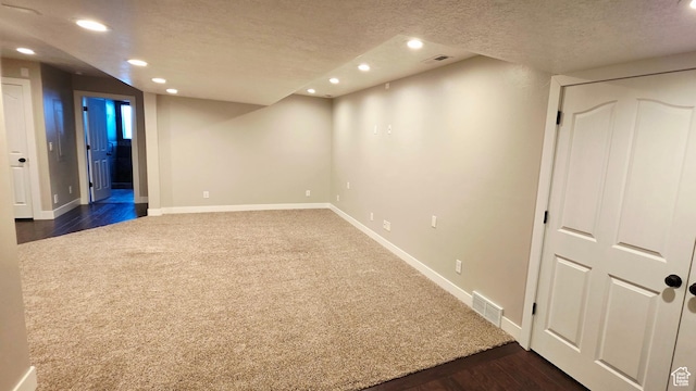 65 E 300 S, Salina, UT 84654 - finished below grade area with dark colored carpet, recessed lighting, a textured ceiling, and dark wood finished floors