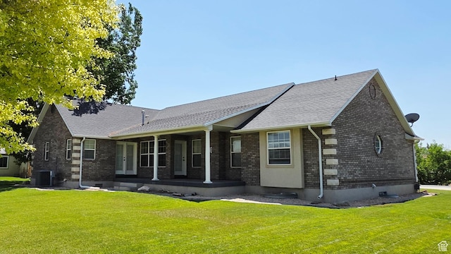 65 E 300 S, Salina, UT 84654 - back of house with brick siding, a porch, a lawn, and a shingled roof