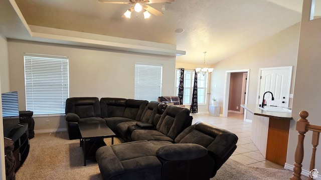 65 E 300 S, Salina, UT 84654 - living area with ceiling fan, vaulted ceiling, light tile patterned flooring, a chandelier, and plenty of natural light