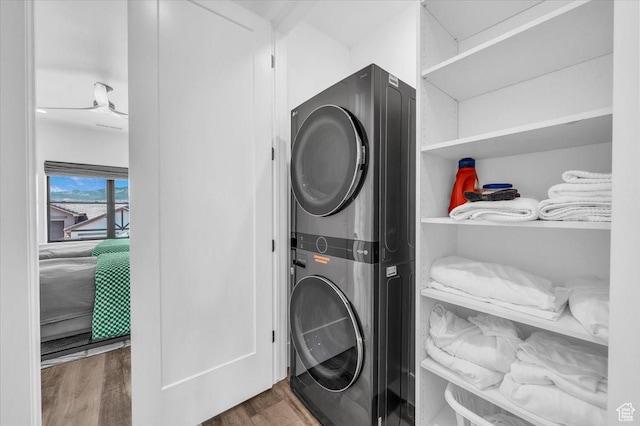 772 E Prairie Way, Washington, UT 84780 - washroom with stacked washer / drying machine and wood finished floors
