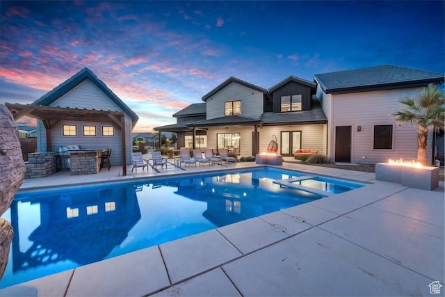 772 E Prairie Way, Washington, UT 84780 - view of pool featuring a fire pit, a patio area, a pool with connected hot tub, and area for grilling
