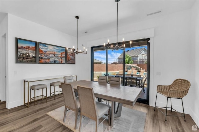 772 E Prairie Way, Washington, UT 84780 - dining space featuring a chandelier and wood finished floors