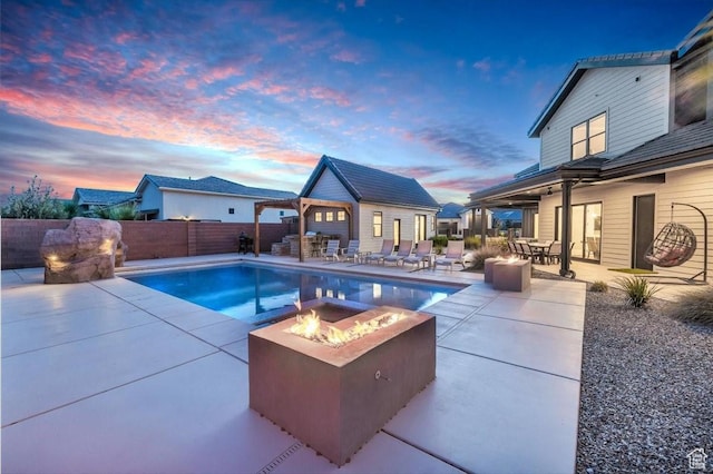 772 E Prairie Way, Washington, UT 84780 - view of swimming pool with an outdoor fire pit, an outbuilding, a patio area, a fenced backyard, and an exterior structure
