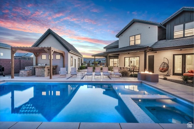 772 E Prairie Way, Washington, UT 84780 - pool at dusk with area for grilling, a pool with connected hot tub, a patio, and a pergola