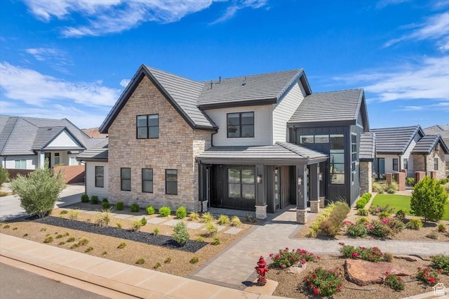 772 E Prairie Way, Washington, UT 84780 - view of front facade featuring stone siding and a tile roof