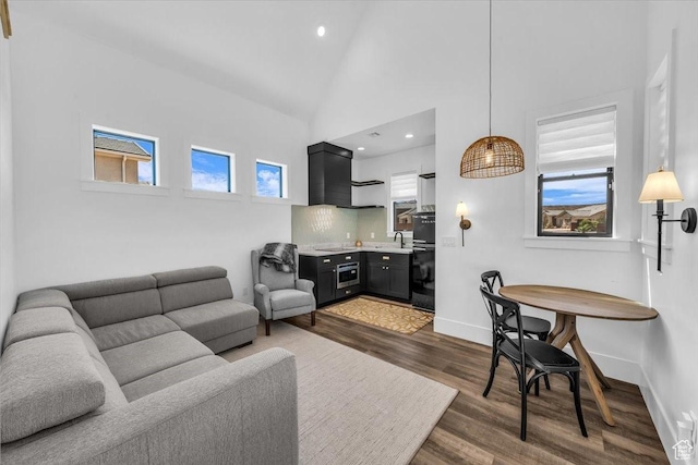 772 E Prairie Way, Washington, UT 84780 - living area with dark wood-style flooring, high vaulted ceiling, healthy amount of natural light, and recessed lighting