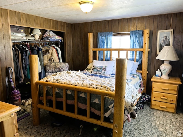 5223 N 930 E, Scofield, UT 84526 - bedroom featuring a closet, carpet flooring, and wood walls