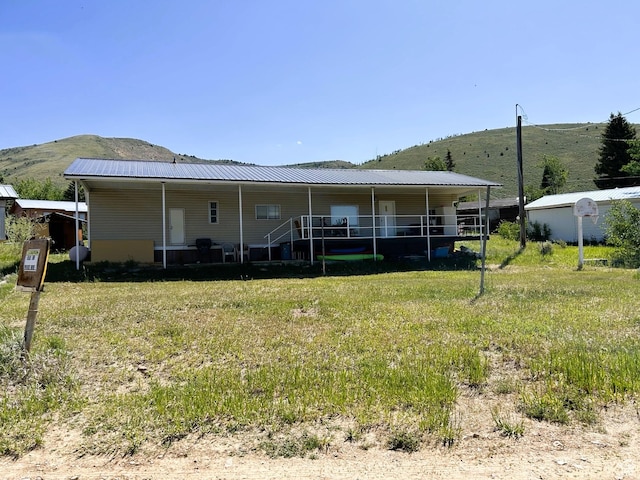 5223 N 930 E, Scofield, UT 84526 - rear view of house with a mountain view and a metal roof