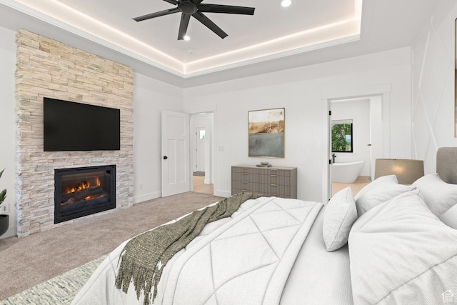 3359 W 3500 S, Wellsville, UT 84339 - bedroom with carpet flooring, a fireplace, ensuite bathroom, a raised ceiling, and ceiling fan