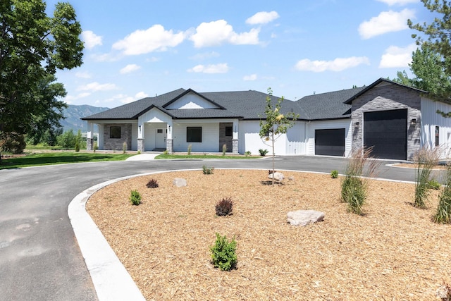 3359 W 3500 S, Wellsville, UT 84339 - modern farmhouse style home with asphalt driveway, a garage, and stone siding