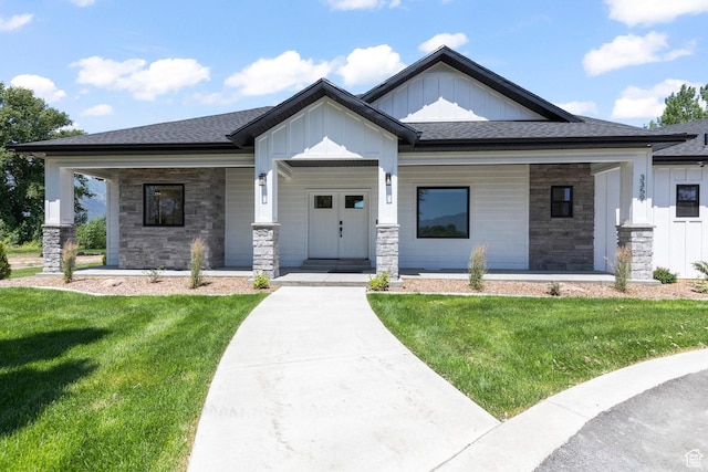 3359 W 3500 S, Wellsville, UT 84339 - view of front of house with board and batten siding, a porch, stone siding, and a front lawn