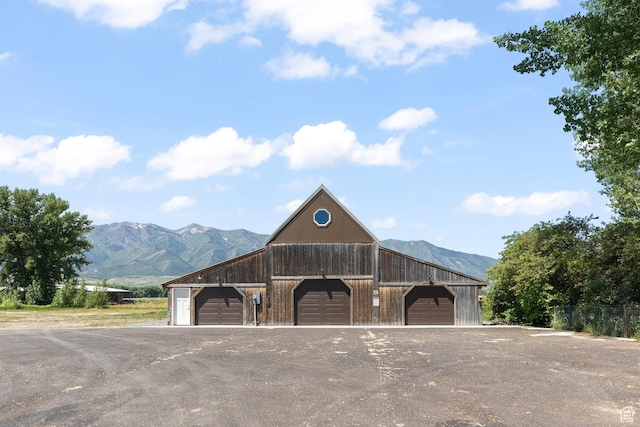 3359 W 3500 S, Wellsville, UT 84339 - view of building exterior featuring a mountain view, a garage, and a barn