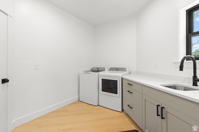 3359 W 3500 S, Wellsville, UT 84339 - laundry area with washing machine and clothes dryer, light wood-style flooring, and cabinet space