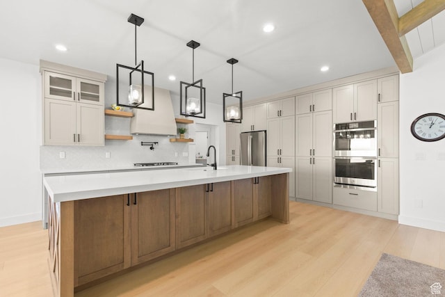 3359 W 3500 S, Wellsville, UT 84339 - kitchen with appliances with stainless steel finishes, open shelves, light wood-type flooring, decorative backsplash, and light countertops