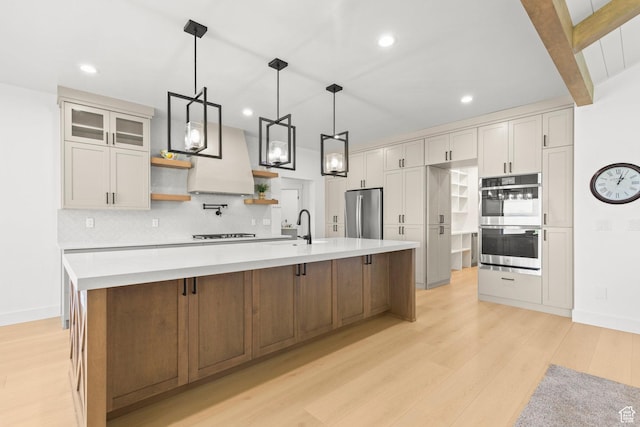 3359 W 3500 S, Wellsville, UT 84339 - kitchen with stainless steel appliances, open shelves, light wood-style flooring, backsplash, and light countertops