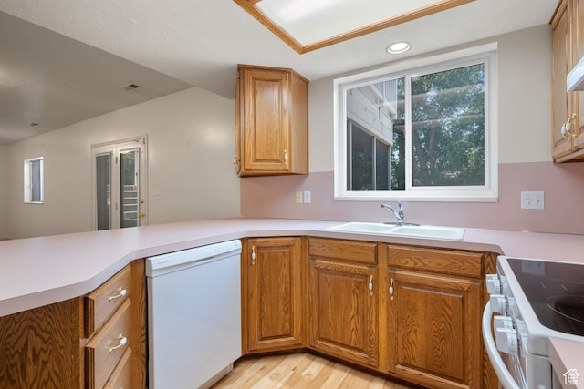 560 S 1350 E, Fruit Heights, UT 84037 - kitchen with white appliances, light wood-style floors, a peninsula, brown cabinetry, and light countertops