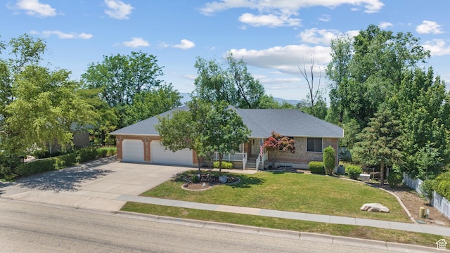 560 S 1350 E, Fruit Heights, UT 84037 - view of front of home with driveway, a front lawn, and an attached garage
