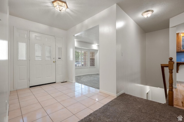 560 S 1350 E, Fruit Heights, UT 84037 - entrance foyer with light colored carpet, light tile patterned flooring, and a textured ceiling