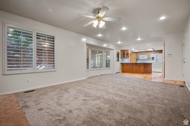 560 S 1350 E, Fruit Heights, UT 84037 - unfurnished living room featuring light colored carpet, a ceiling fan, and recessed lighting