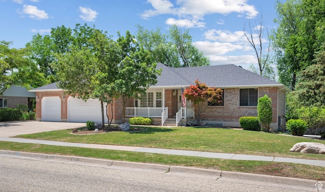 560 S 1350 E, Fruit Heights, UT 84037 - view of front of property featuring brick siding, covered porch, an attached garage, driveway, and a front lawn