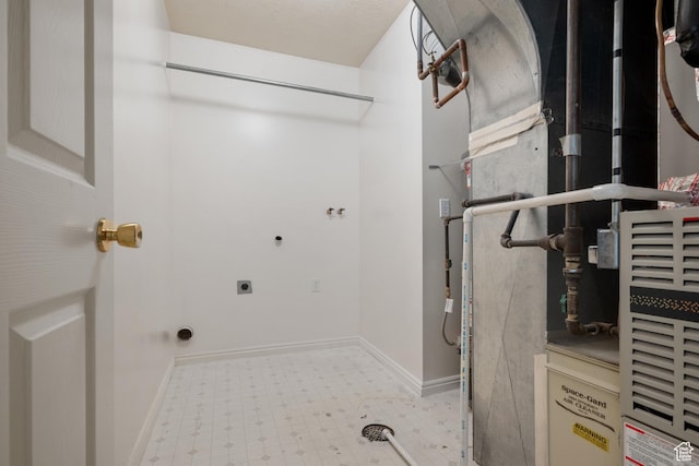 560 S 1350 E, Fruit Heights, UT 84037 - laundry room with electric dryer hookup, tile patterned floors, and heating unit