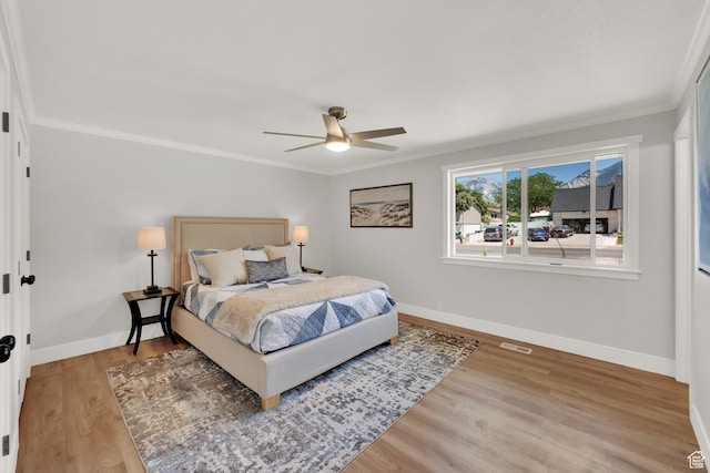 10852 S Starpine Dr, Sandy, UT 84094 - bedroom with ornamental molding, light wood finished floors, and ceiling fan