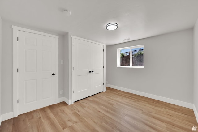 10852 S Starpine Dr, Sandy, UT 84094 - unfurnished bedroom with light wood-style flooring and a closet