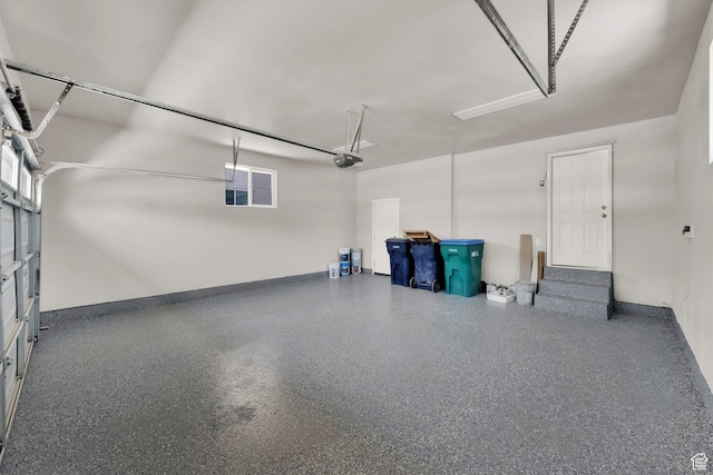 10852 S Starpine Dr, Sandy, UT 84094 - garage featuring a garage door opener and baseboards