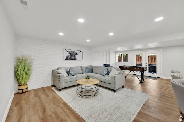 10852 S Starpine Dr, Sandy, UT 84094 - living room with light wood-style floors, recessed lighting, and brick wall