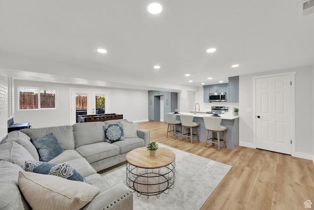 10852 S Starpine Dr, Sandy, UT 84094 - living area with light wood-style flooring and recessed lighting