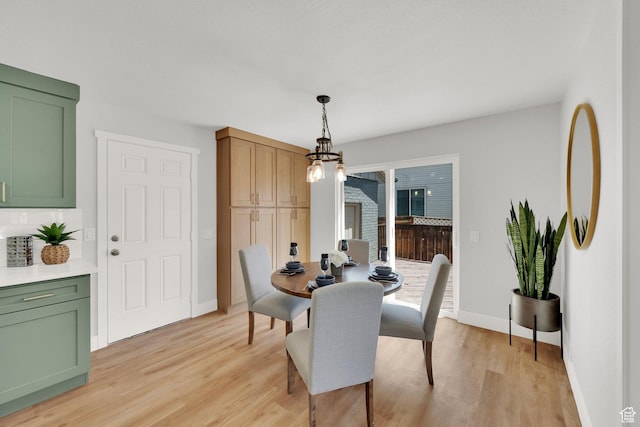10852 S Starpine Dr, Sandy, UT 84094 - dining room featuring light wood-type flooring and a chandelier