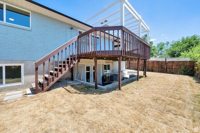 10852 S Starpine Dr, Sandy, UT 84094 - back of house with stairway, a deck, brick siding, and a fenced backyard