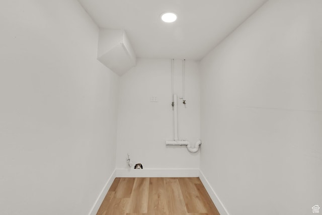 10852 S Starpine Dr, Sandy, UT 84094 - washroom with baseboards and light wood-style floors