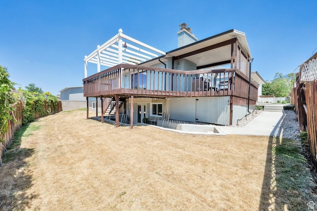 10852 S Starpine Dr, Sandy, UT 84094 - rear view of property featuring a wooden deck, a fenced backyard, stairs, and a chimney