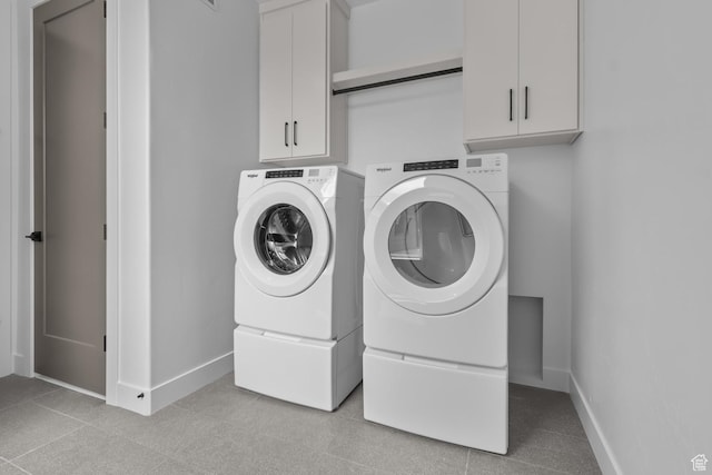 4269 N Maple Hollow Dr Unit 117, Lehi, UT 84043 - laundry room featuring washing machine and dryer, cabinet space, and light tile patterned floors