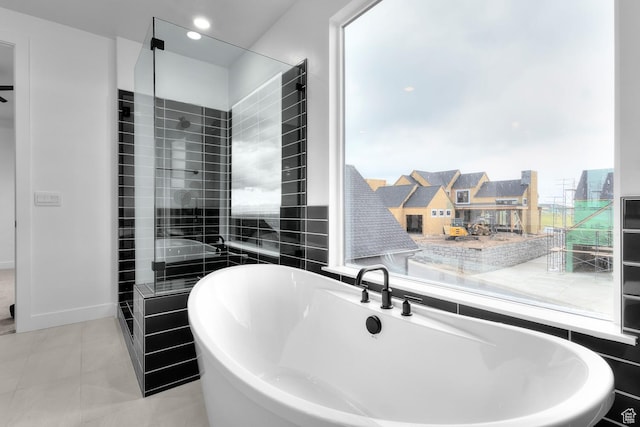 4269 N Maple Hollow Dr Unit 117, Lehi, UT 84043 - bathroom featuring a freestanding tub, tile patterned flooring, and a shower stall