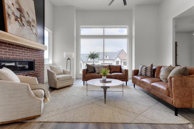 4269 N Maple Hollow Dr Unit 117, Lehi, UT 84043 - living room with a fireplace, a ceiling fan, and wood finished floors