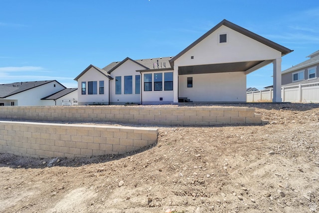 7991 S Ambrosia Ln, West Jordan, UT 84081 - rear view of house featuring stucco siding