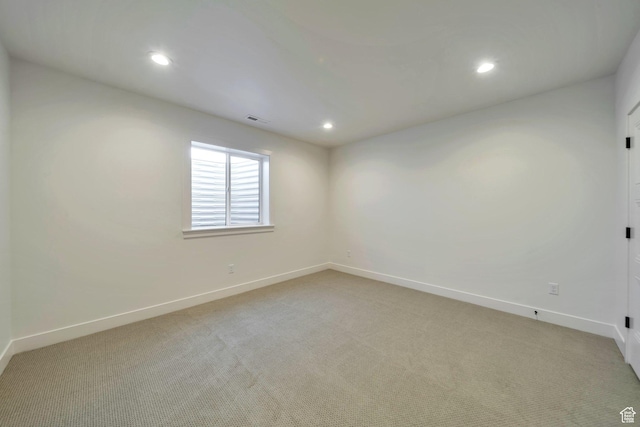 7991 S Ambrosia Ln, West Jordan, UT 84081 - spare room featuring light colored carpet and recessed lighting